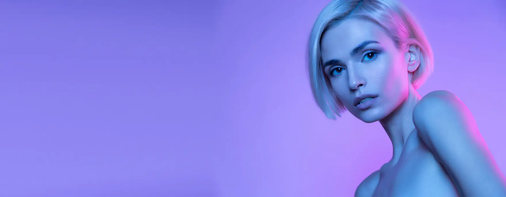 Morpheus8 skin treatment at Square Mile Clinic, City of London Studio portrait lit in purple and blue